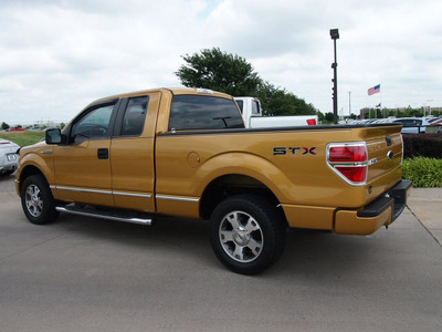 ford f 150 2009 gold stx gasoline 8 cylinders 2 wheel drive automatic with overdrive 76018