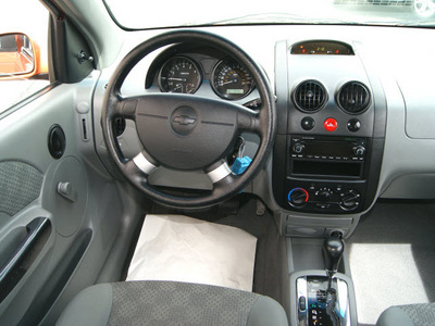 chevrolet aveo 2005 orange hatchback ls gasoline 4 cylinders front wheel drive automatic 80905