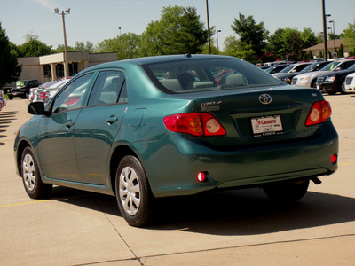 toyota corolla 2010 dk  green sedan le gasoline 4 cylinders front wheel drive automatic 62034