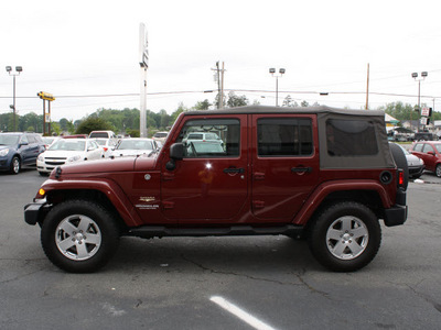 jeep wrangler unlimited 2010 red suv sahara gasoline 6 cylinders 4 wheel drive automatic 27215