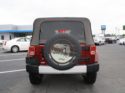 jeep wrangler unlimited 2010 red suv sahara gasoline 6 cylinders 4 wheel drive automatic 27215