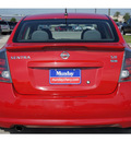 nissan sentra 2009 red sedan gasoline 4 cylinders front wheel drive automatic 77090