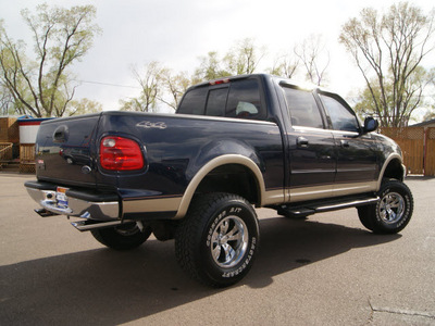 ford f 150 2001 deep wedgewood blue lariat gasoline 8 cylinders 4 wheel drive automatic 80911