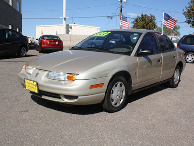 saturn s series 2002 gold sedan sl1 gasoline 4 cylinders front wheel drive automatic 80229