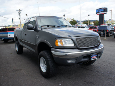 ford f 150 2002 dk  gray xlt 4x4 gasoline 8 cylinders 4 wheel drive automatic with overdrive 98371