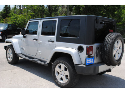jeep wrangler unlimited 2009 silver suv sahara gasoline 6 cylinders 4 wheel drive automatic with overdrive 77037