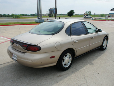 ford taurus 1999 gold sedan se gasoline v6 front wheel drive automatic 76087