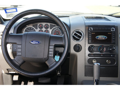ford f 150 2007 black pickup truck flex fuel 8 cylinders rear wheel drive 4 speed automatic 77090