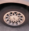 lincoln town car 1999 beige sedan signature gasoline v8 rear wheel drive automatic 28217