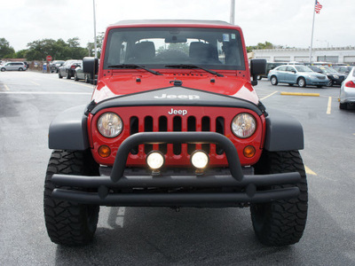 jeep wrangler unlimited 2011 red suv sport gasoline 6 cylinders 4 wheel drive 6 speed manual 33021