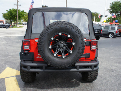 jeep wrangler unlimited 2011 red suv sport gasoline 6 cylinders 4 wheel drive 6 speed manual 33021