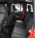 jeep wrangler unlimited 2011 red suv sport gasoline 6 cylinders 4 wheel drive 6 speed manual 33021