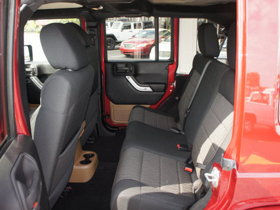 jeep wrangler unlimited 2011 red suv sahara gasoline 6 cylinders 4 wheel drive automatic 33021