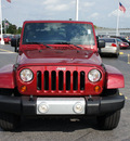 jeep wrangler unlimited 2011 red suv sahara gasoline 6 cylinders 4 wheel drive automatic 33021