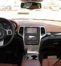 jeep grand cherokee 2011 beige suv overland gasoline 6 cylinders 2 wheel drive automatic 76210