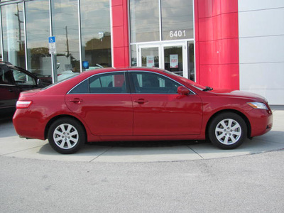 toyota camry 2009 red sedan xle gasoline 4 cylinders front wheel drive automatic 33884