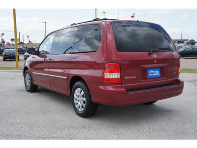 kia sedona 2005 red van lx gasoline 6 cylinders front wheel drive automatic 77037