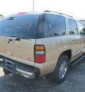 gmc yukon 2005 beige suv slt gasoline 8 cylinders 4 wheel drive automatic 45324