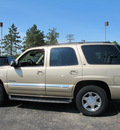 gmc yukon 2005 beige suv slt gasoline 8 cylinders 4 wheel drive automatic 45324