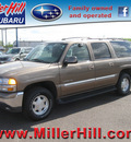 gmc yukon xl 2004 beige suv 1500 flex fuel 8 cylinders 4 wheel drive automatic 55811