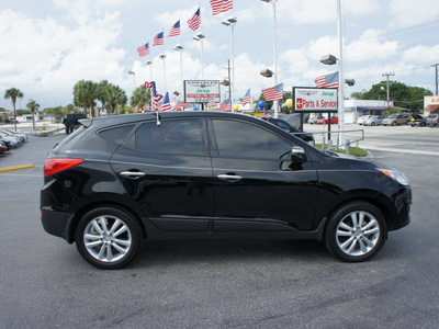 hyundai tucson 2011 black limited gasoline 4 cylinders front wheel drive automatic 33021