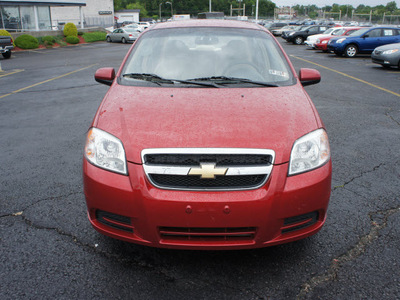 chevrolet aveo 2011 red sedan lt gasoline 4 cylinders front wheel drive automatic 19153