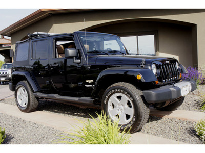 jeep wrangler unlimited 2011 black suv sahara gasoline 6 cylinders 4 wheel drive automatic 99352