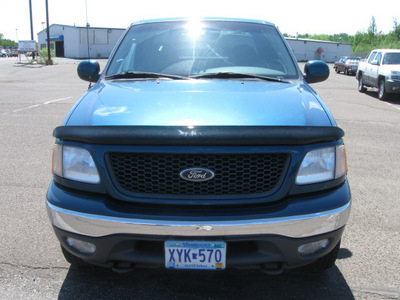 ford f 150 2000 blue flareside xlt gasoline v8 4 wheel drive automatic 55811