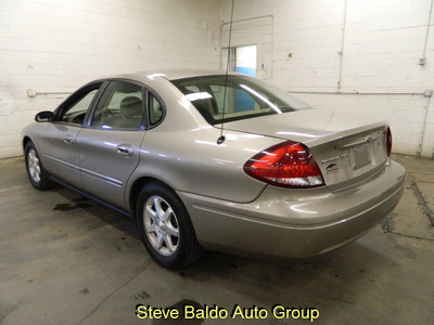 ford taurus 2006 tan sedan sel gasoline 6 cylinders front wheel drive automatic 14304