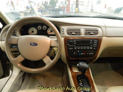 ford taurus 2006 tan sedan sel gasoline 6 cylinders front wheel drive automatic 14304