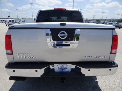 nissan titan 2010 silver pickup truck le flex fuel 8 cylinders 2 wheel drive automatic 77388