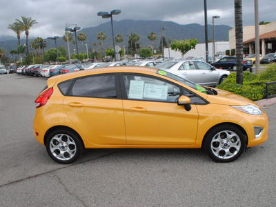 ford fiesta 2011 orange hatchback ses gasoline 4 cylinders front wheel drive automatic 91010