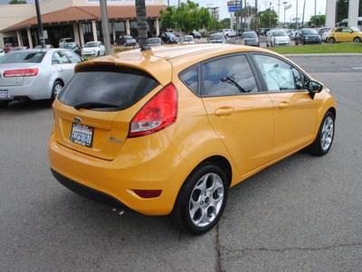 ford fiesta 2011 orange hatchback ses gasoline 4 cylinders front wheel drive automatic 91010