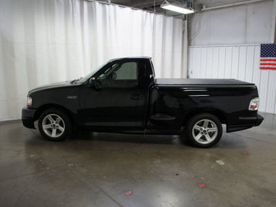 ford f 150 svt lightning 2003 black pickup truck gasoline 8 cylinders rear wheel drive automatic with overdrive 76108