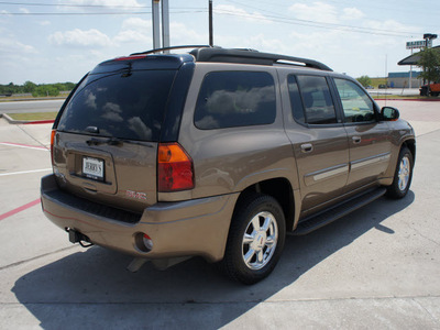 gmc envoy xl 2003 brown suv slt gasoline 6 cylinders 4 wheel drive automatic 76087