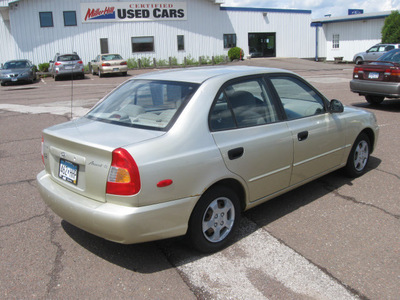 hyundai accent 2002 tan sedan gl gasoline 4 cylinders front wheel drive automatic with overdrive 55811
