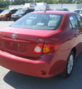 toyota corolla 2010 red sedan le gasoline 4 cylinders front wheel drive automatic 62863