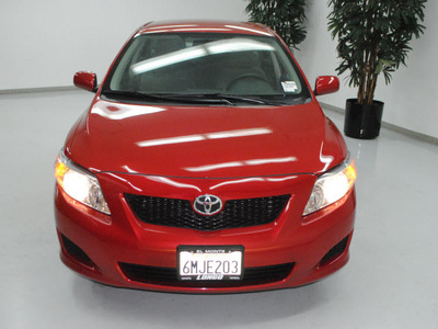 toyota corolla 2010 red sedan le gasoline 4 cylinders front wheel drive automatic 91731