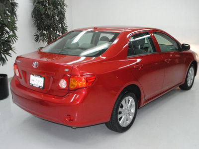 toyota corolla 2010 red sedan le gasoline 4 cylinders front wheel drive automatic 91731