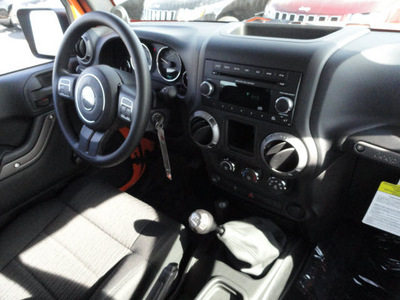 jeep wrangler 2012 orange suv sport gasoline 6 cylinders 4 wheel drive 6 speed manual 60915