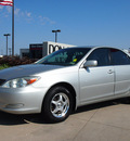 toyota camry 2004 silver sedan le gasoline 4 cylinders front wheel drive automatic with overdrive 76018