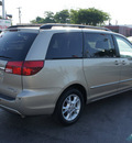 toyota sienna 2005 lt  brown van xle limited 7 passenger gasoline 6 cylinders front wheel drive automatic 33021