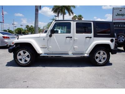 jeep wrangler unlimited 2010 white suv sahara gasoline 6 cylinders 4 wheel drive automatic 33157