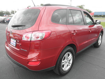 hyundai santa fe 2011 red gls gasoline 4 cylinders front wheel drive automatic 34474