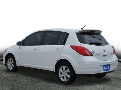 nissan versa 2009 white hatchback 1 8 s gasoline 4 cylinders front wheel drive automatic with overdrive 77037