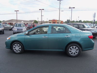 toyota corolla 2010 dk  green sedan le gasoline 4 cylinders front wheel drive automatic 37087