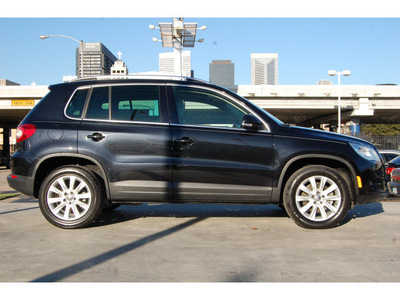 volkswagen tiguan 2009 black suv gasoline 4 cylinders front wheel drive automatic 77002
