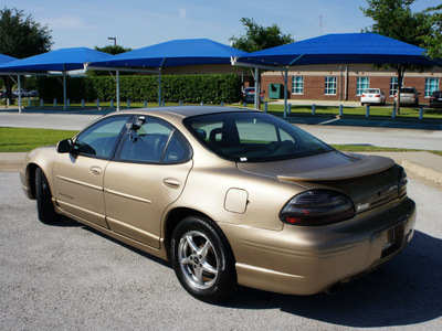 pontiac grand prix 1999 brown sedan gt gasoline 6 cylinders front wheel drive 4 speed automatic 76206