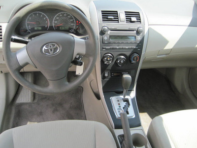 toyota corolla 2010 tan sedan le gasoline 4 cylinders front wheel drive automatic 77301