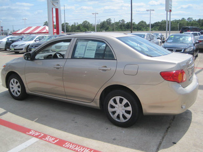 toyota corolla 2010 tan sedan le gasoline 4 cylinders front wheel drive automatic 77301